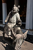 Bangkok Wat Arun - the gallery is lined all around with beautiful statues of chinese figures. 